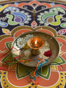 Raksha Bandan thali with Rakhi, rice, diya, and kumkum