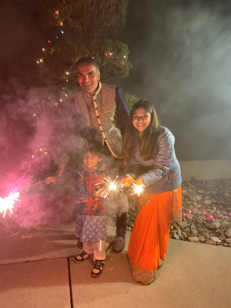 Akruti Babaria, founder of Kulture Khazana, celebrating Diwali night with her family and sparklers